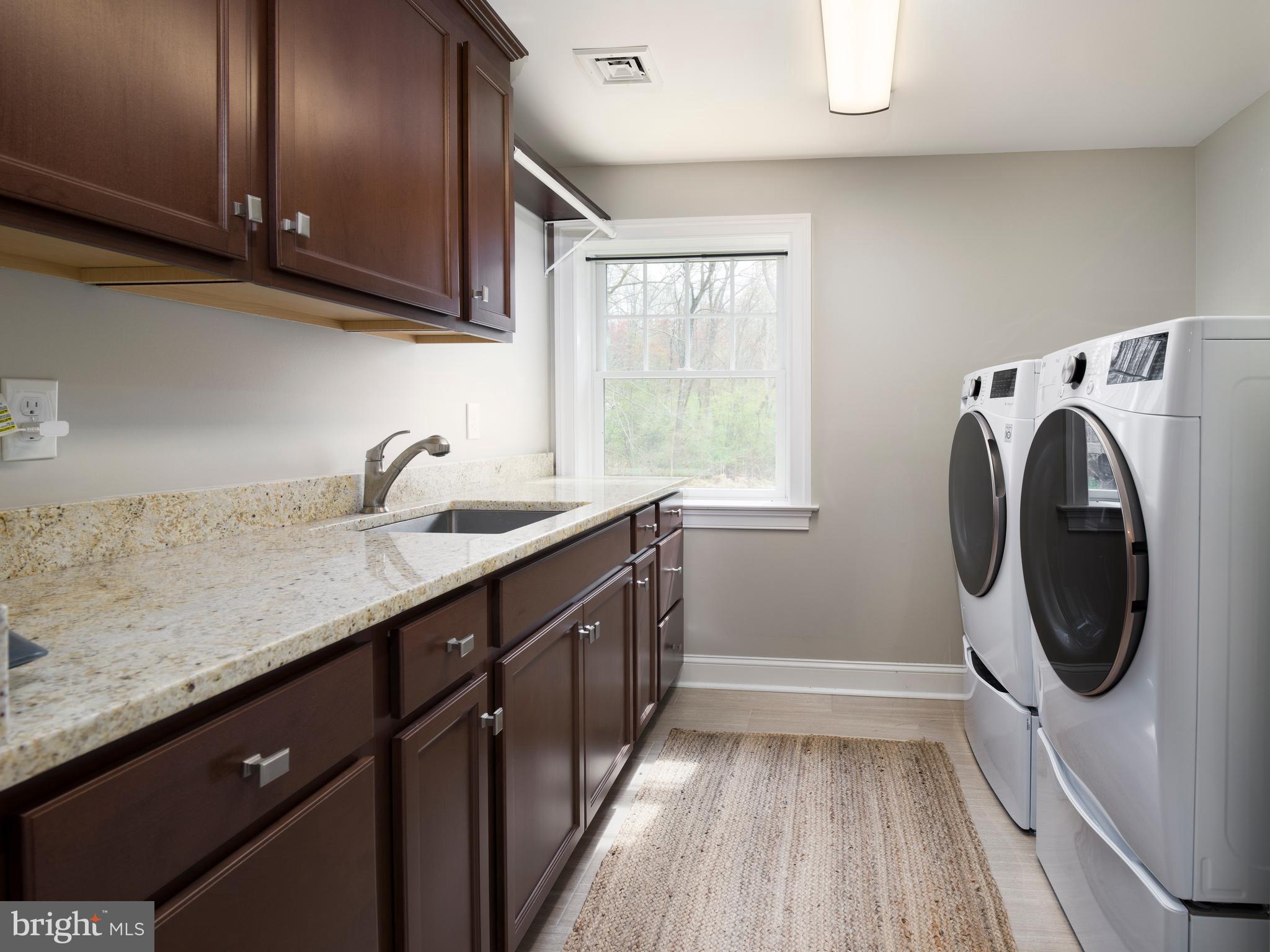 1685 Valley Road Newtown Square, PA 19073 - Photo 48 of 53 a utility room with sink dryer and washer