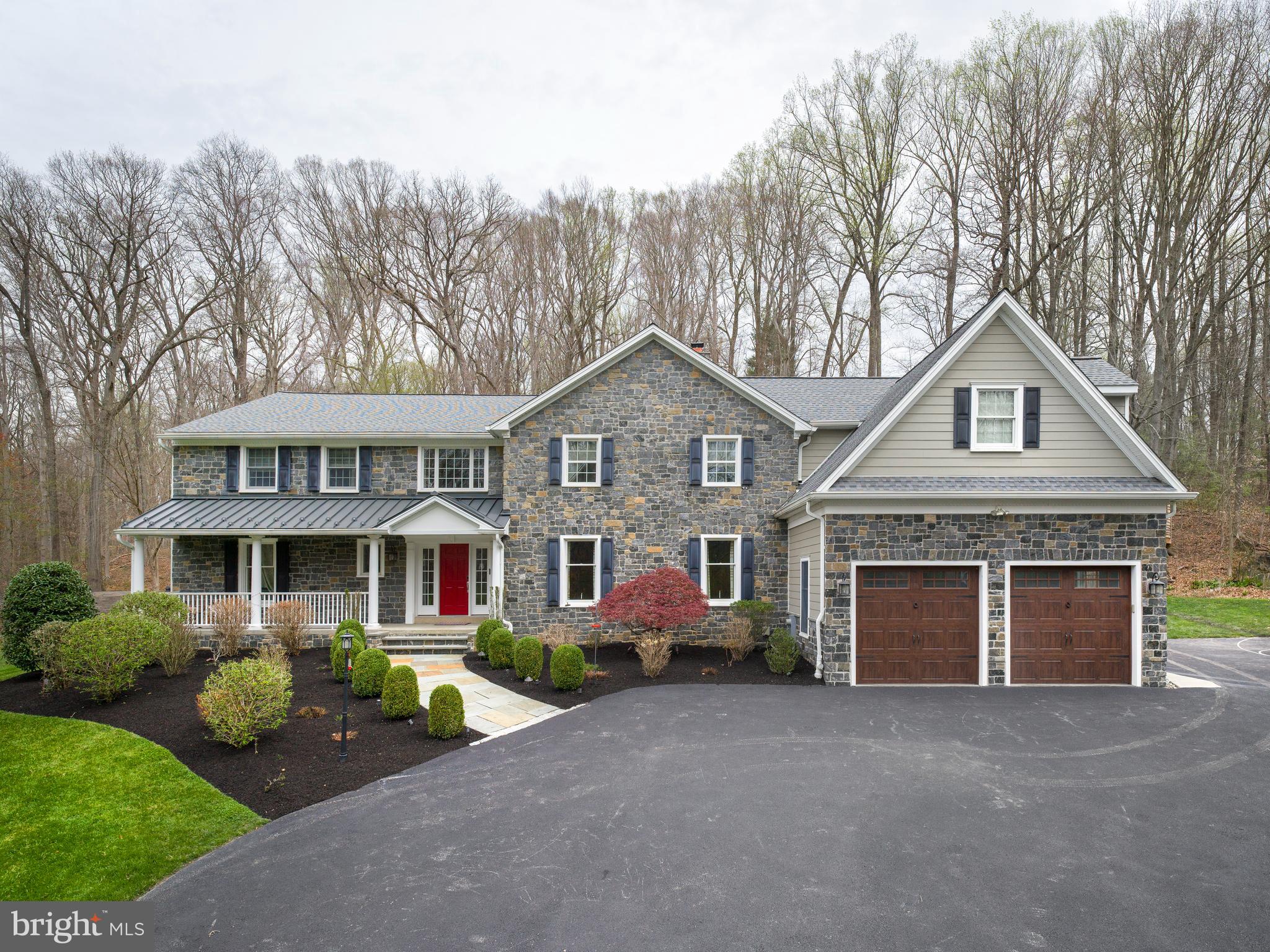1685 Valley Road Newtown Square, PA 19073 - Photo 5 of 53 a front view of a house with a yard and garage