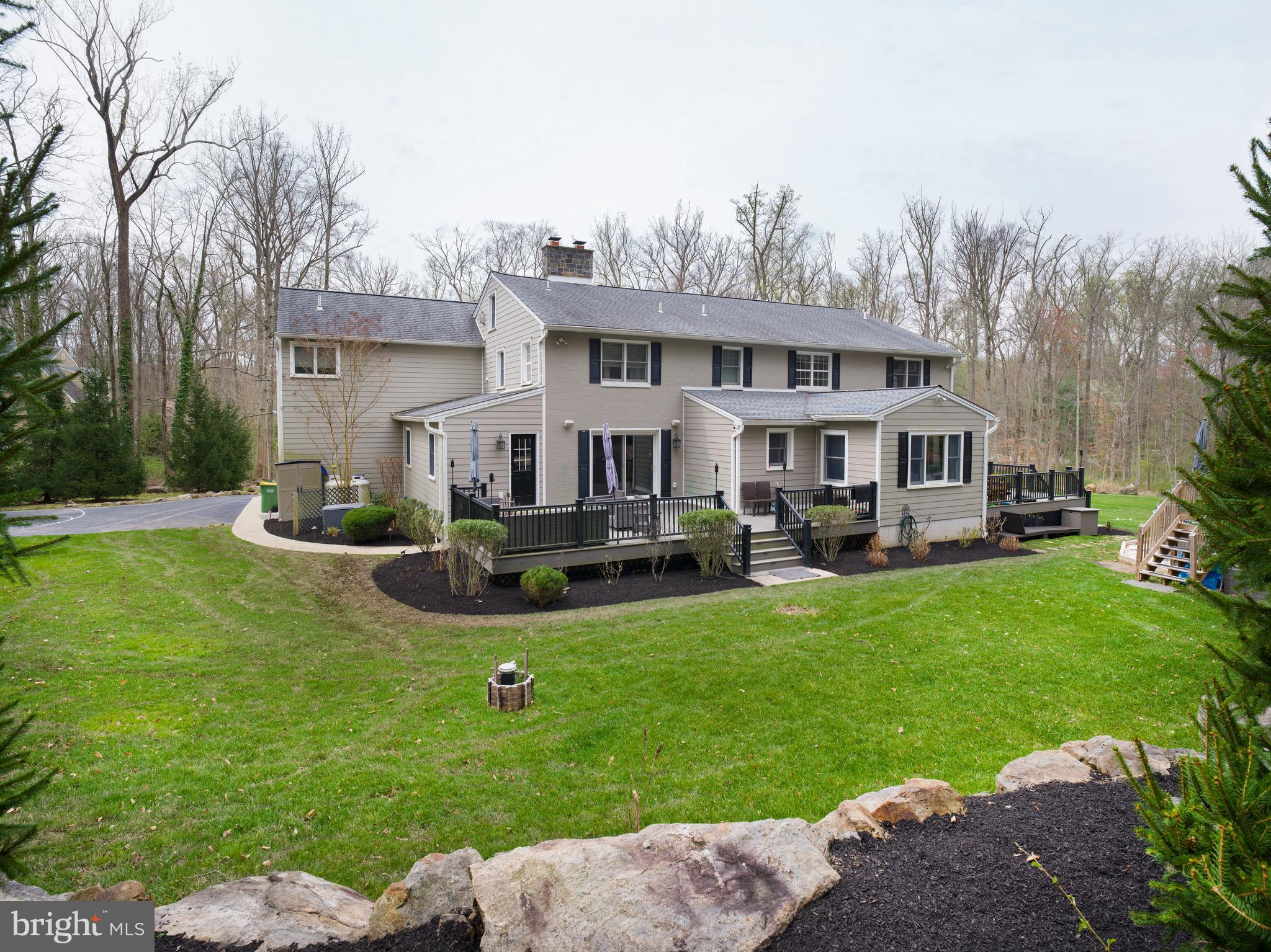 1685 Valley Road Newtown Square, PA 19073 - Photo 52 of 53 a front view of a house with a garden and yard