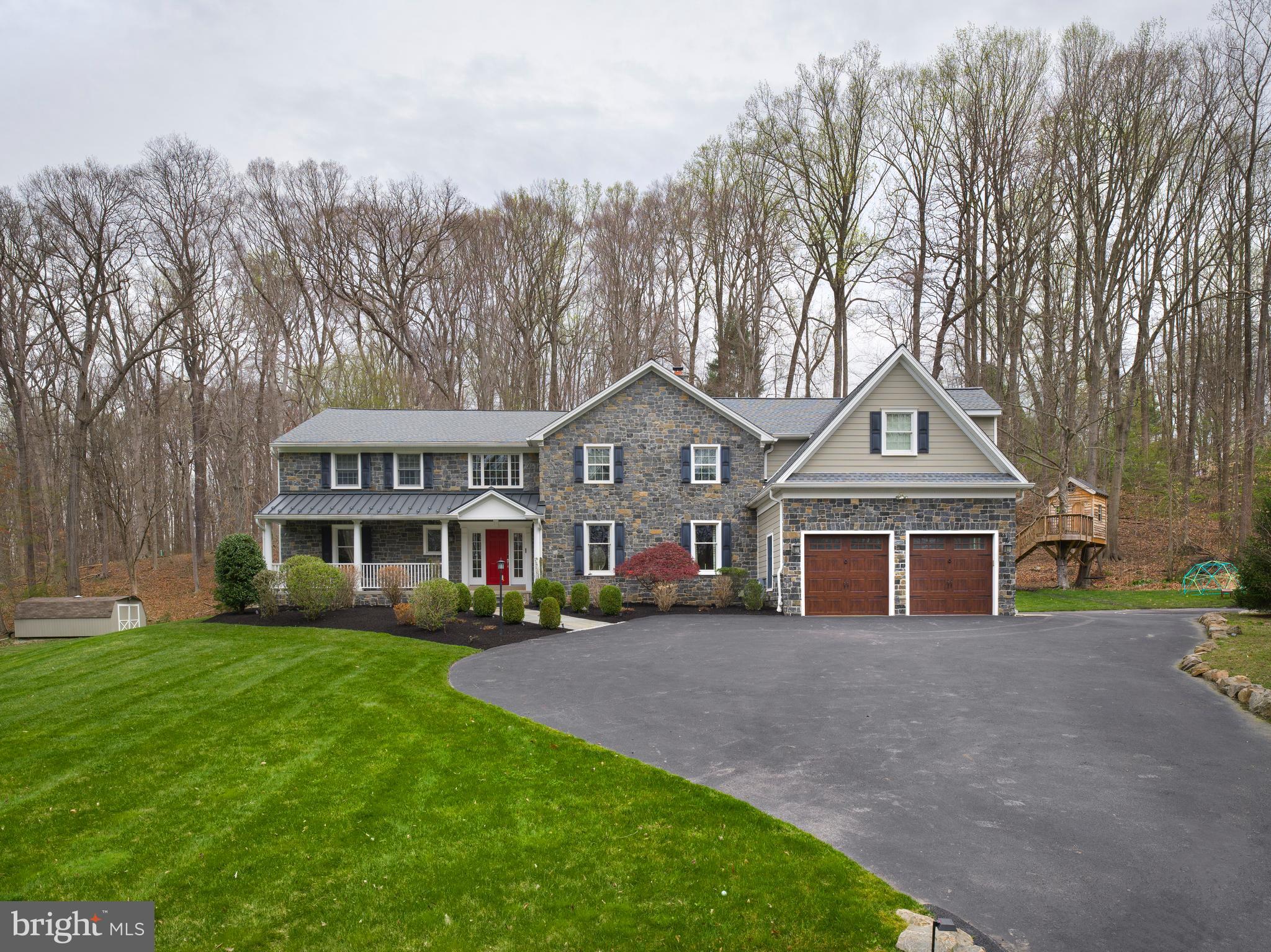 1685 Valley Road Newtown Square, PA 19073 - Photo 6 of 53 a front view of a house with a yard and trees