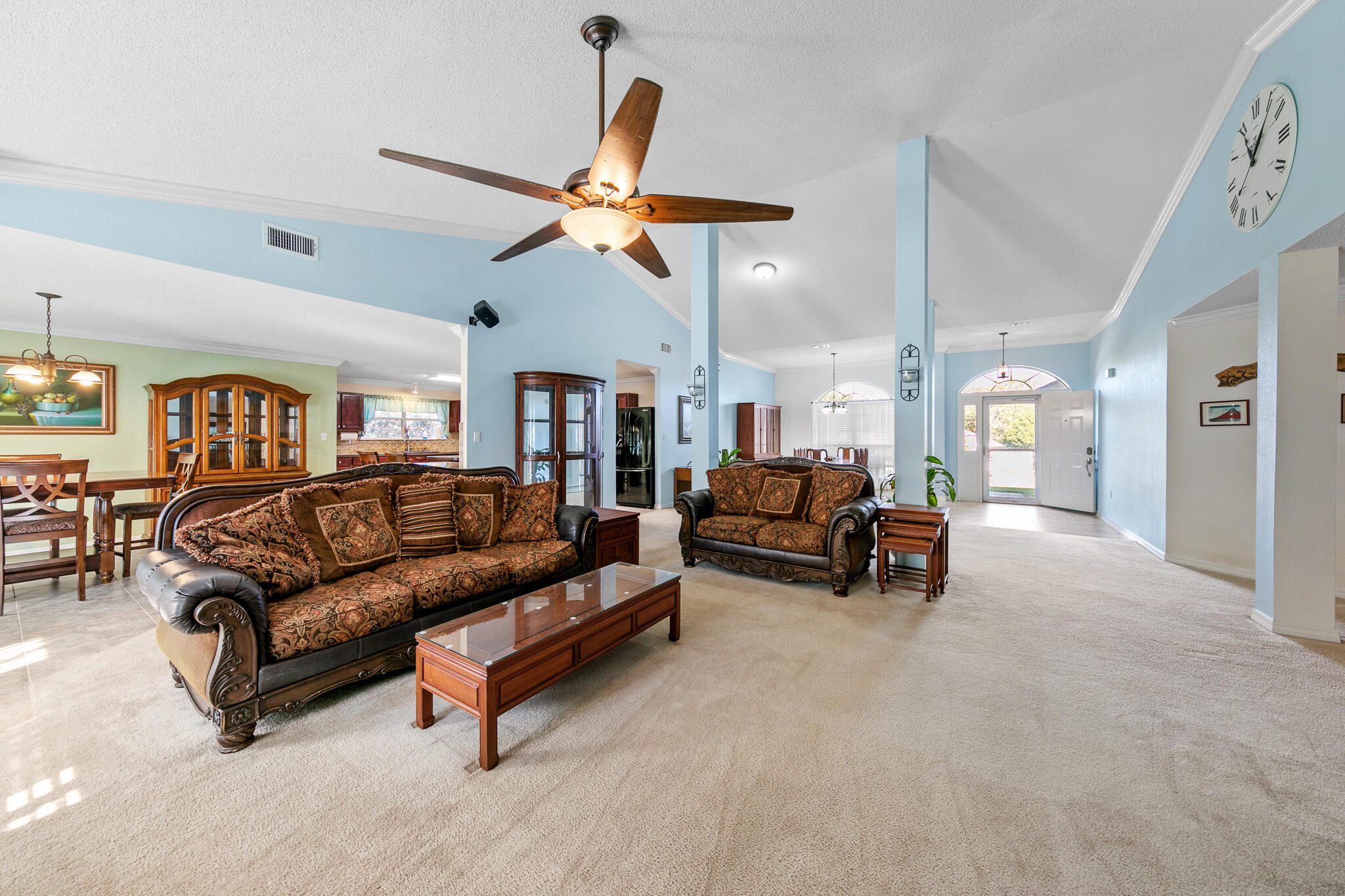 6735 Britt Street Navarre, FL 32566 - Photo 11 of 42 a living room with furniture and a ceiling fan