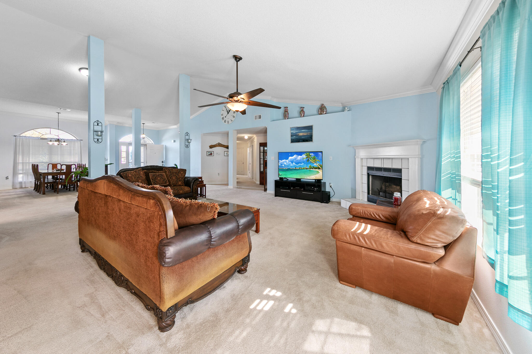 6735 Britt Street Navarre, FL 32566 - Photo 13 of 42 a living room with furniture and a fireplace
