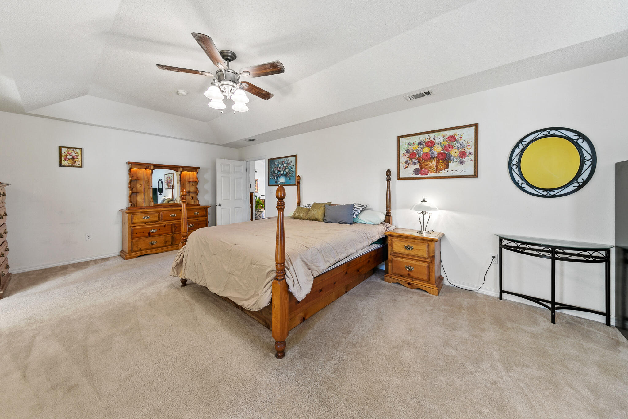 6735 Britt Street Navarre, FL 32566 - Photo 22 of 42 a bedroom with a bed mirror and a window