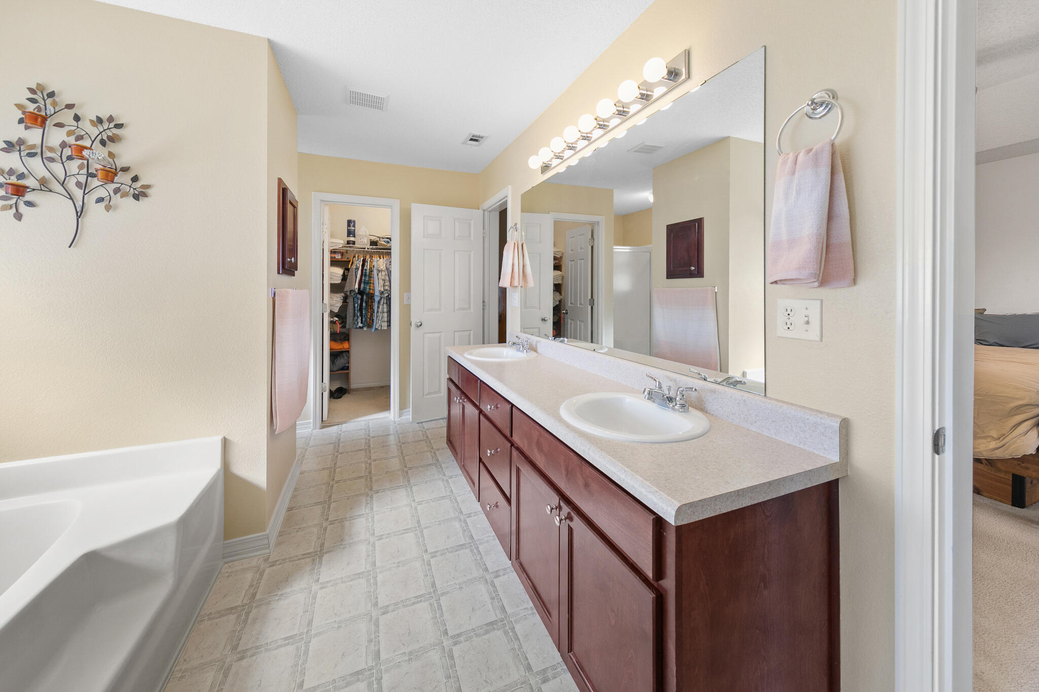 6735 Britt Street Navarre, FL 32566 - Photo 23 of 42 a bathroom with a sink a vanity and a mirror