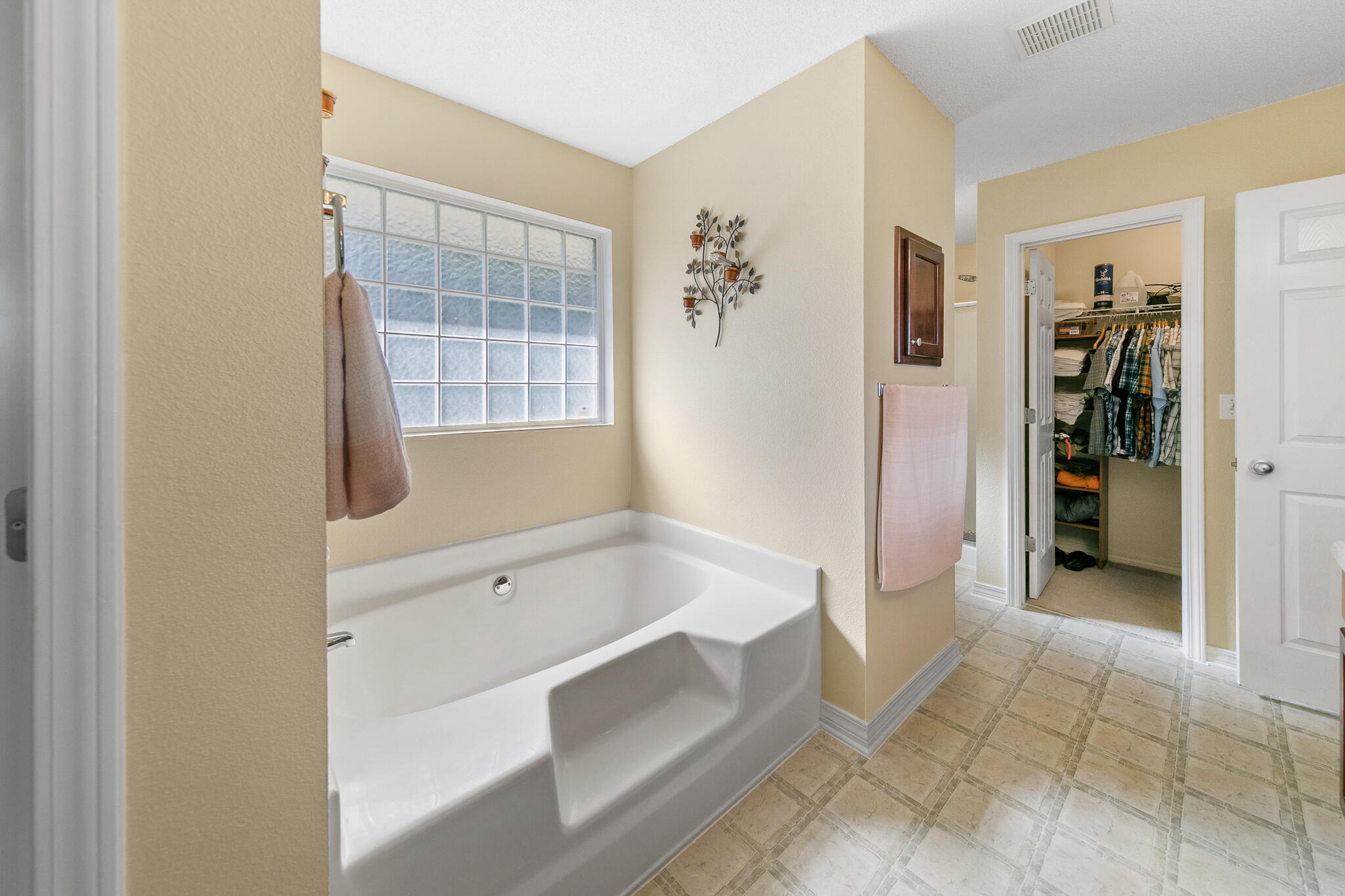 6735 Britt Street Navarre, FL 32566 - Photo 24 of 42 a bathroom with a tub shower and sink