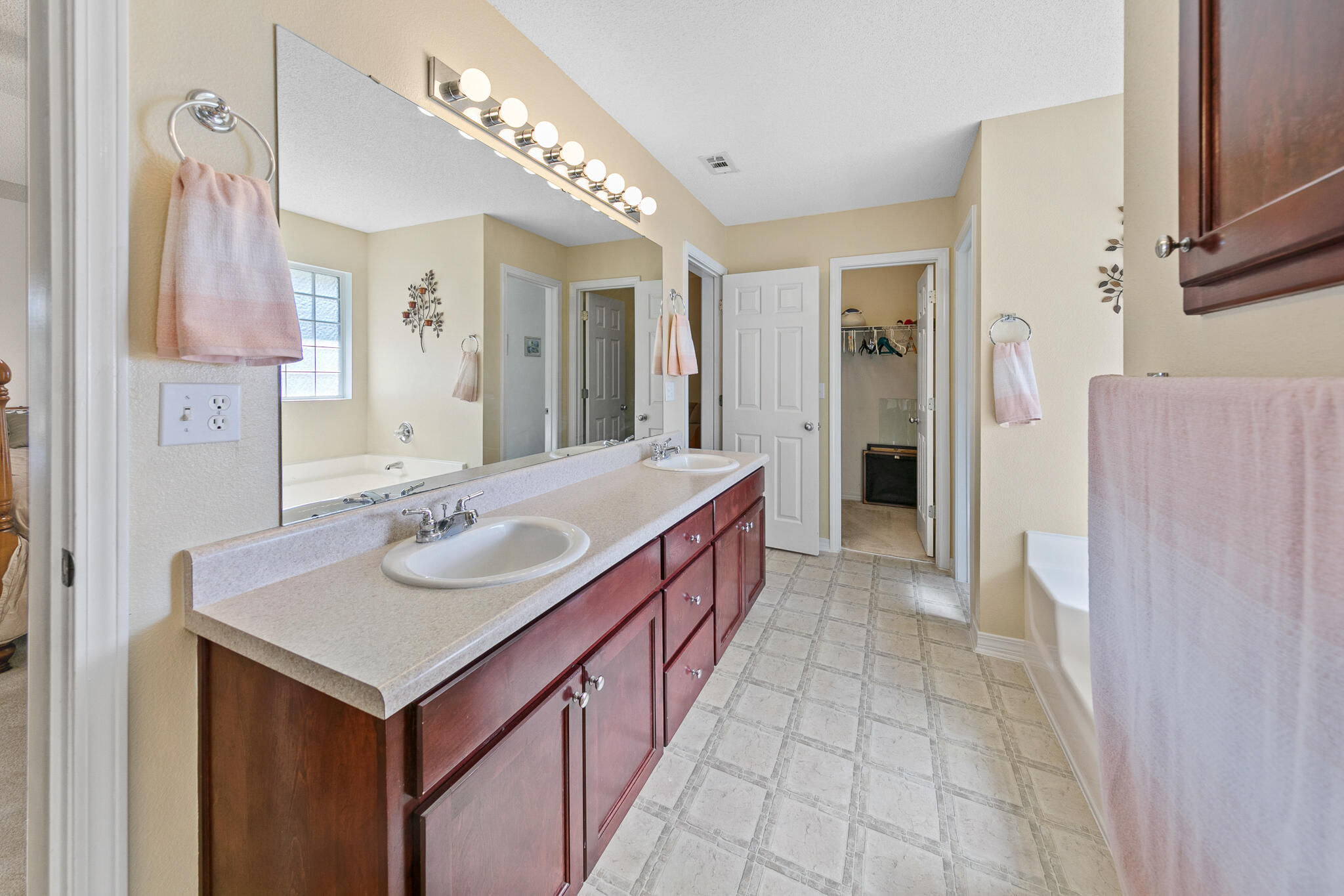 6735 Britt Street Navarre, FL 32566 - Photo 26 of 42 a bathroom with a sink a double vanity and a mirror