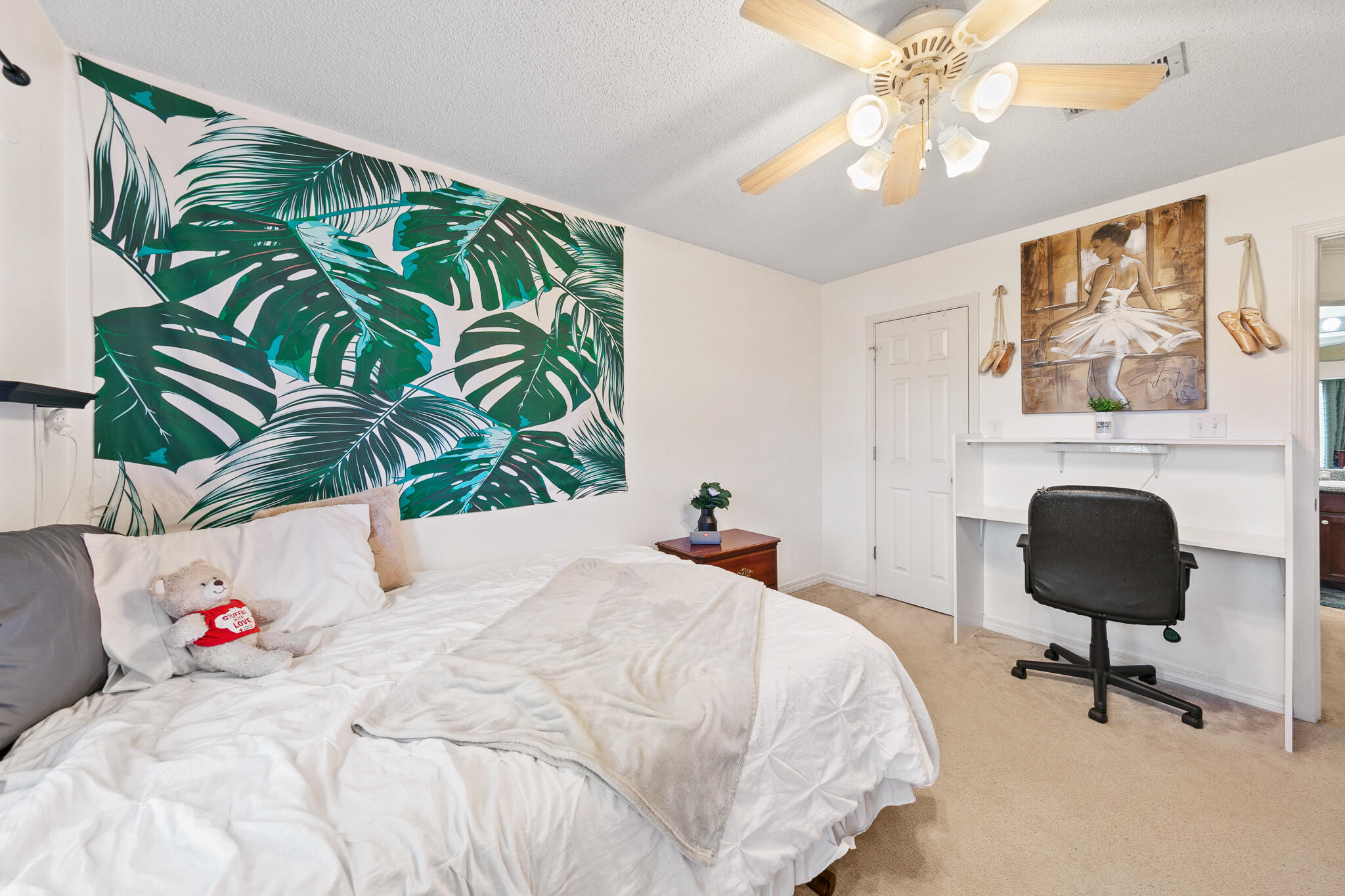 6735 Britt Street Navarre, FL 32566 - Photo 28 of 42 a bedroom with a bed lamps and a chandelier