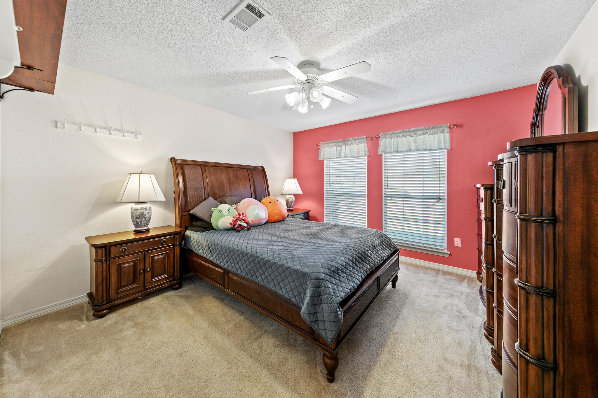6735 Britt Street Navarre, FL 32566 - Photo 32 of 42 a bed room with a bed and a chandelier