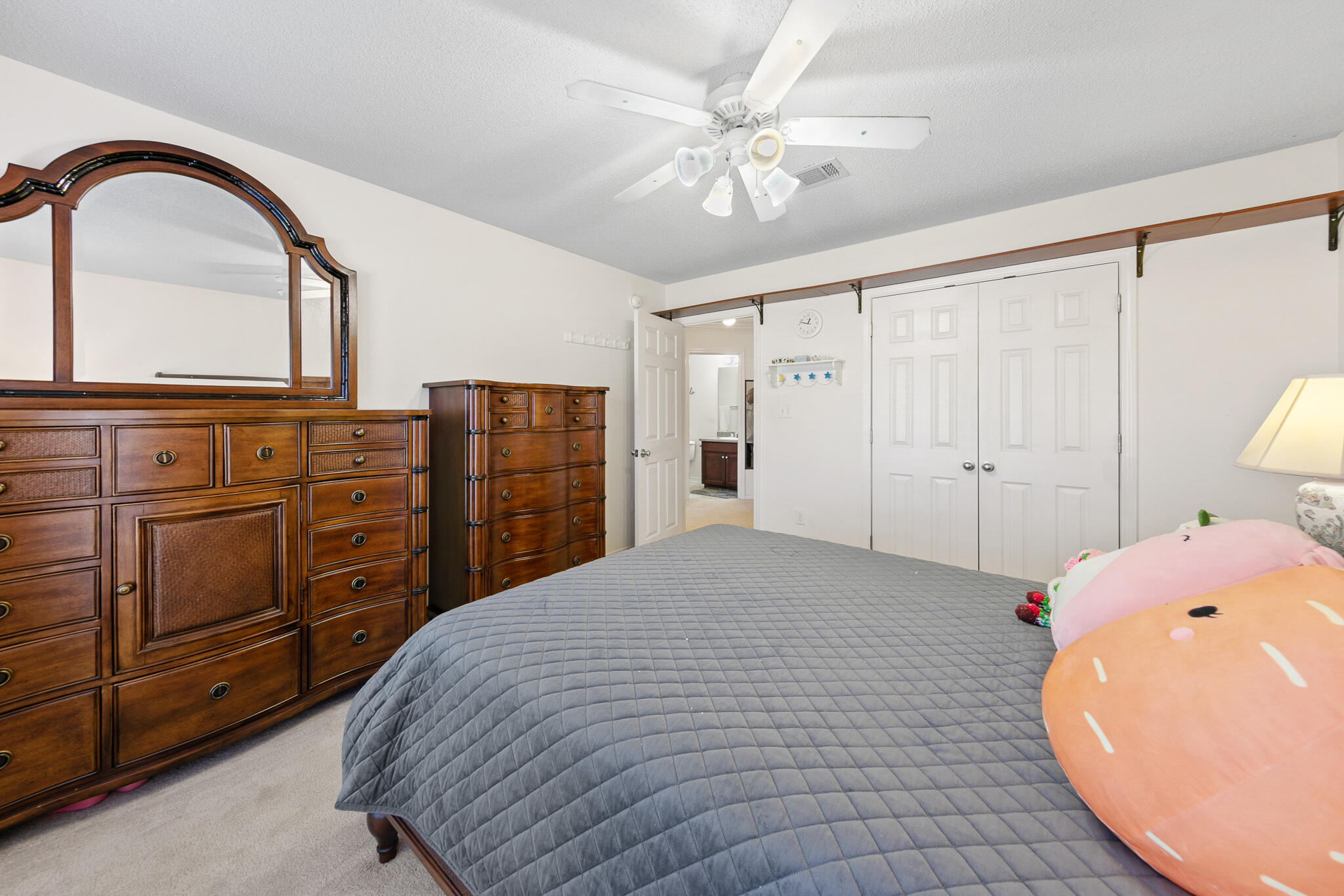 6735 Britt Street Navarre, FL 32566 - Photo 33 of 42 a bedroom with a bed and a dresser