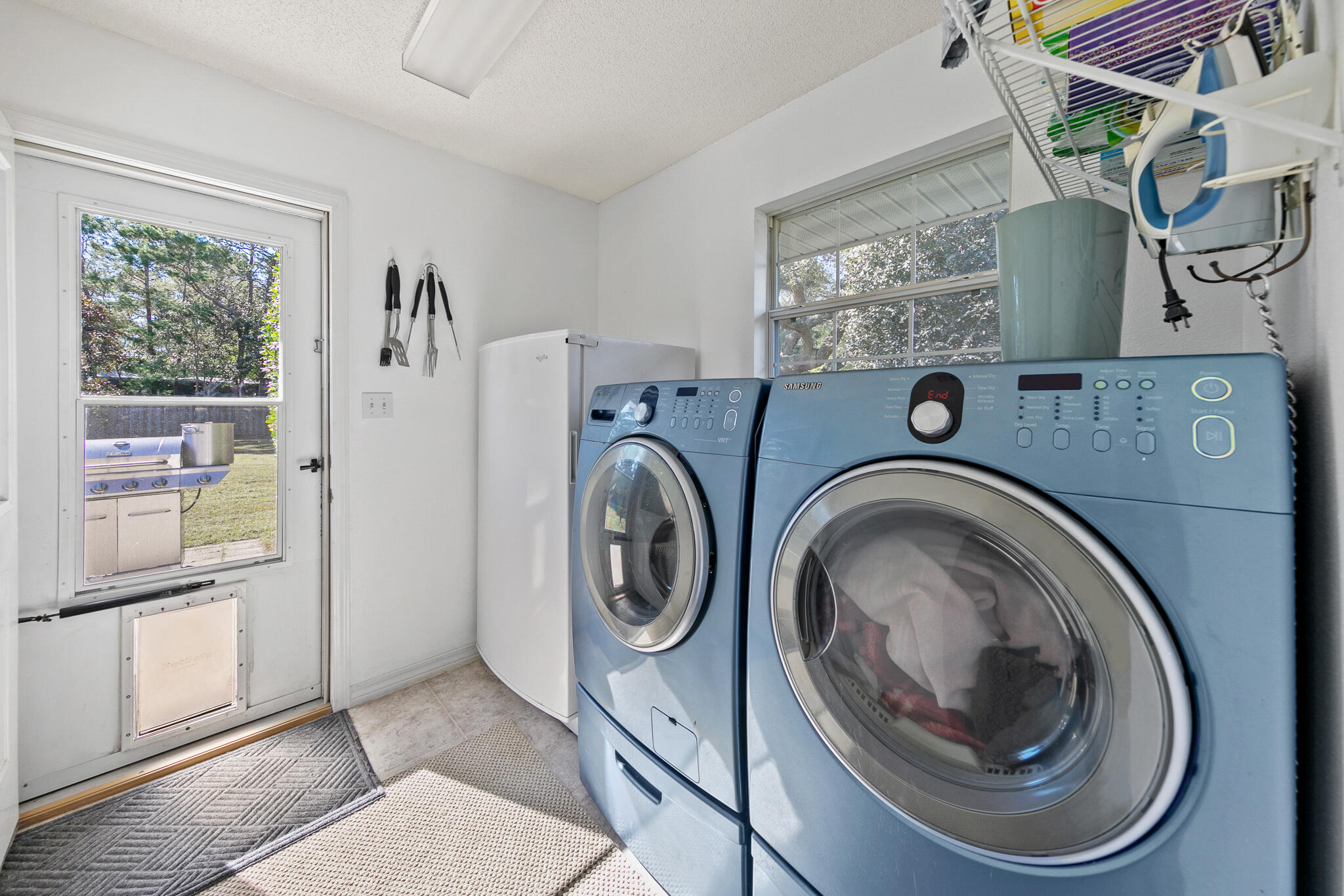 6735 Britt Street Navarre, FL 32566 - Photo 36 of 42 a utility room with dryer and washer