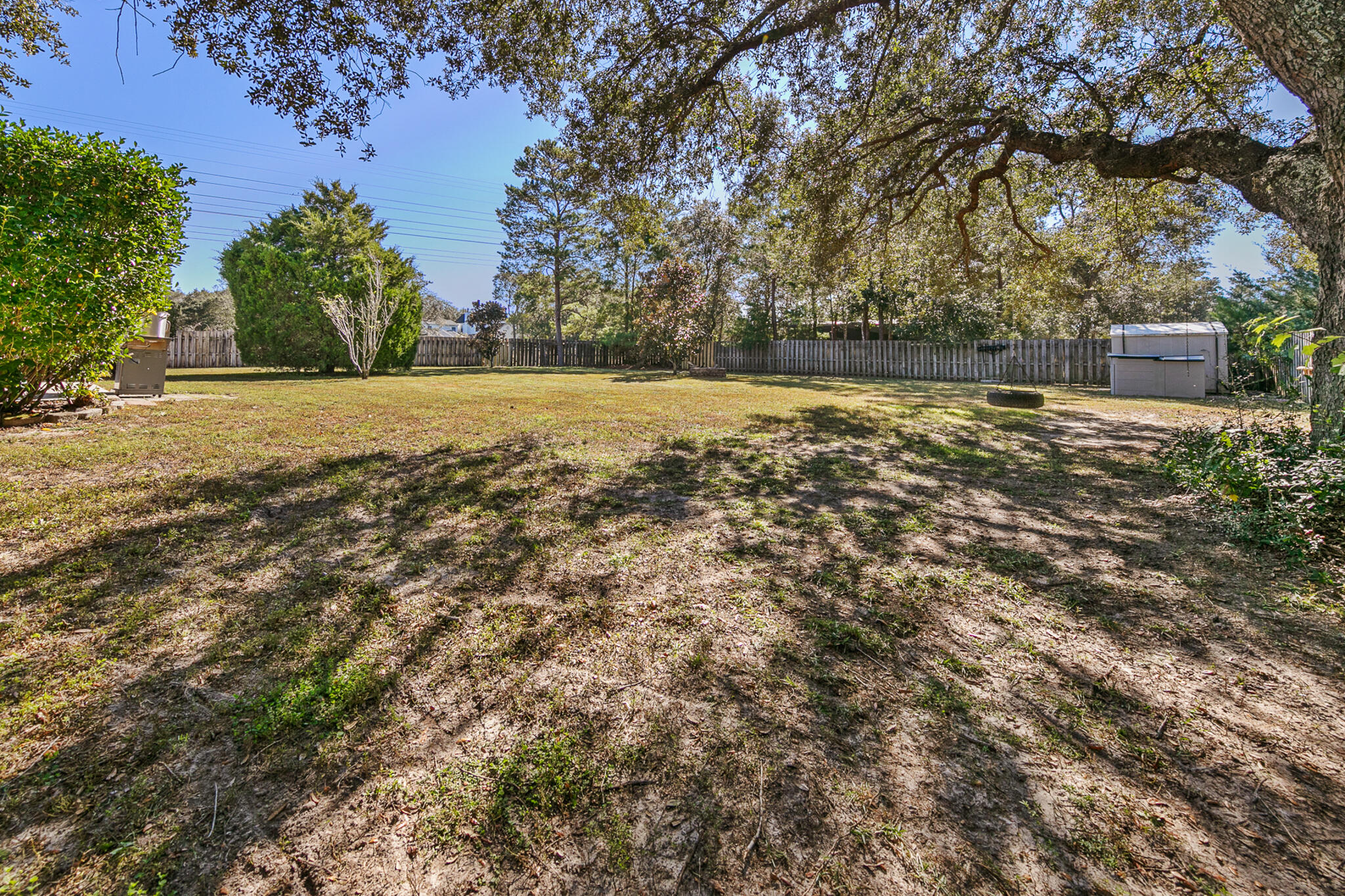 6735 Britt Street Navarre, FL 32566 - Photo 41 of 42 a view of outdoor space with deck and yard