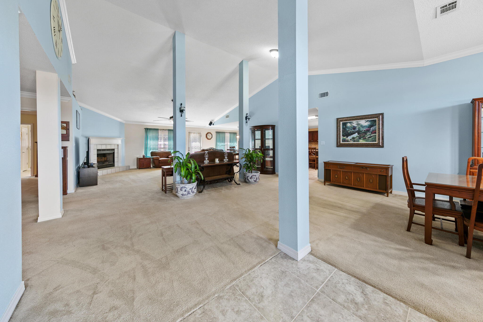 6735 Britt Street Navarre, FL 32566 - Photo 5 of 42 a living room with furniture and a chandelier