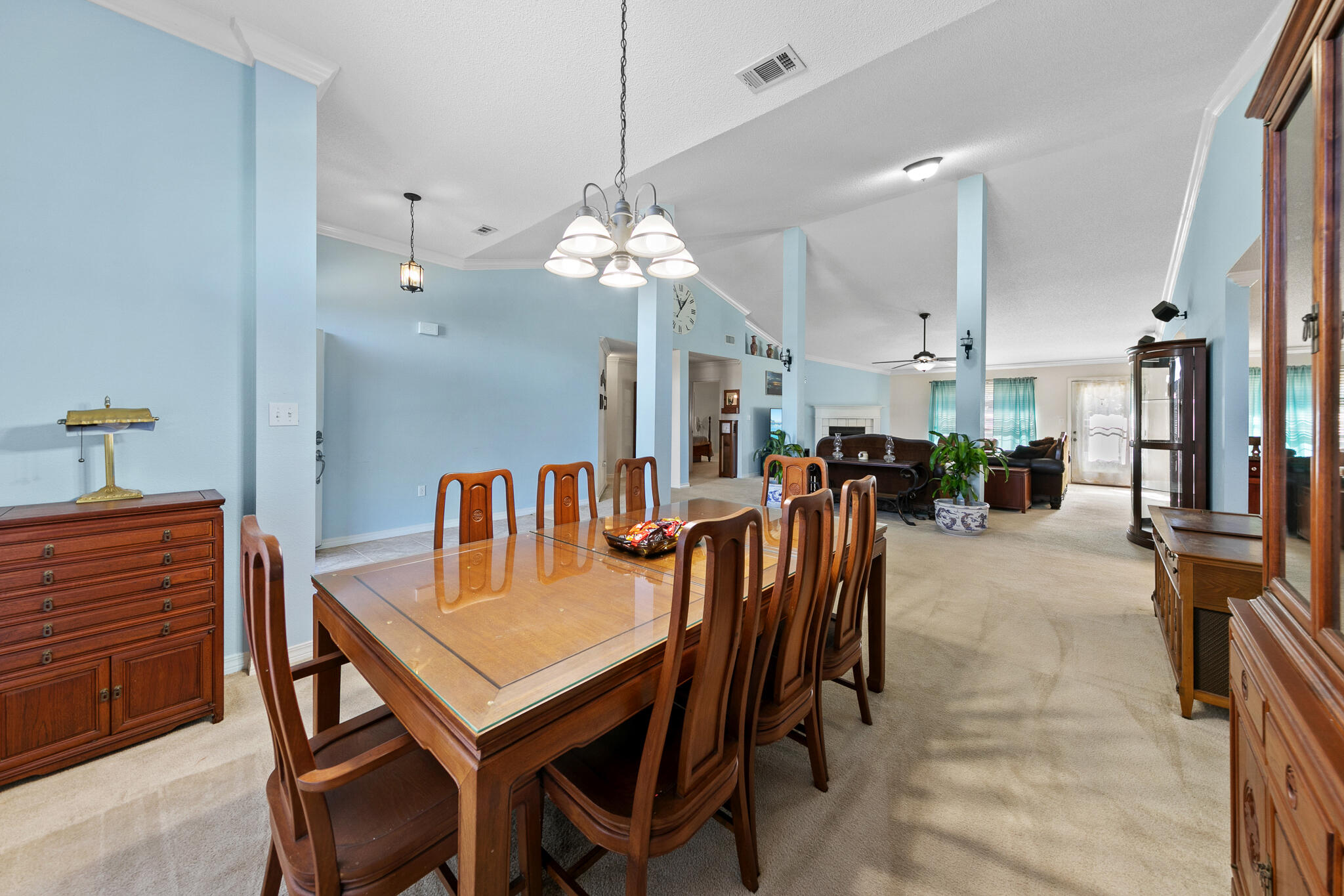 6735 Britt Street Navarre, FL 32566 - Photo 7 of 42 a dining room filled with furniture and a chandelier