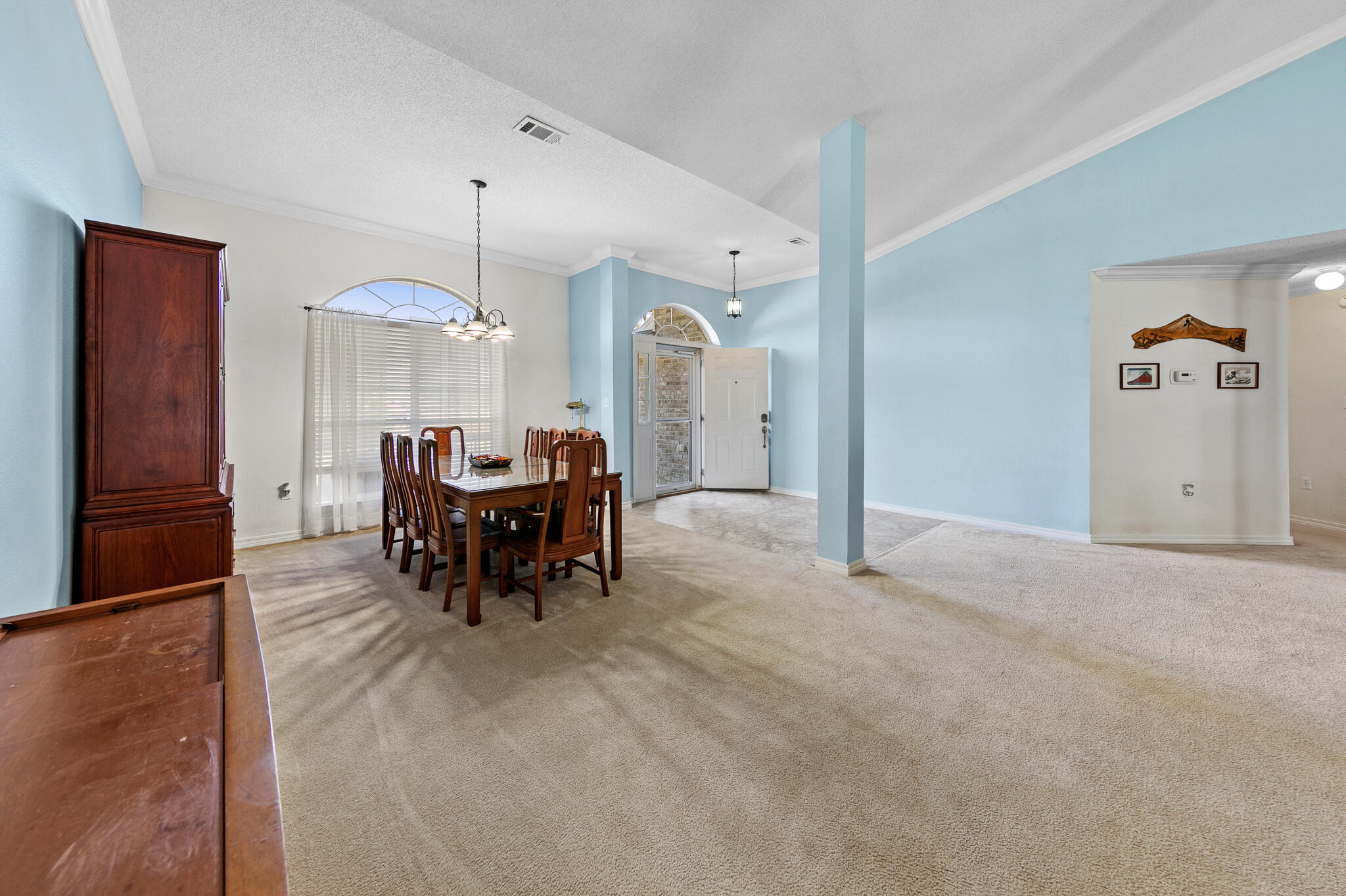 6735 Britt Street Navarre, FL 32566 - Photo 8 of 42 a view of a dining room with furniture and chandelier kitchen view
