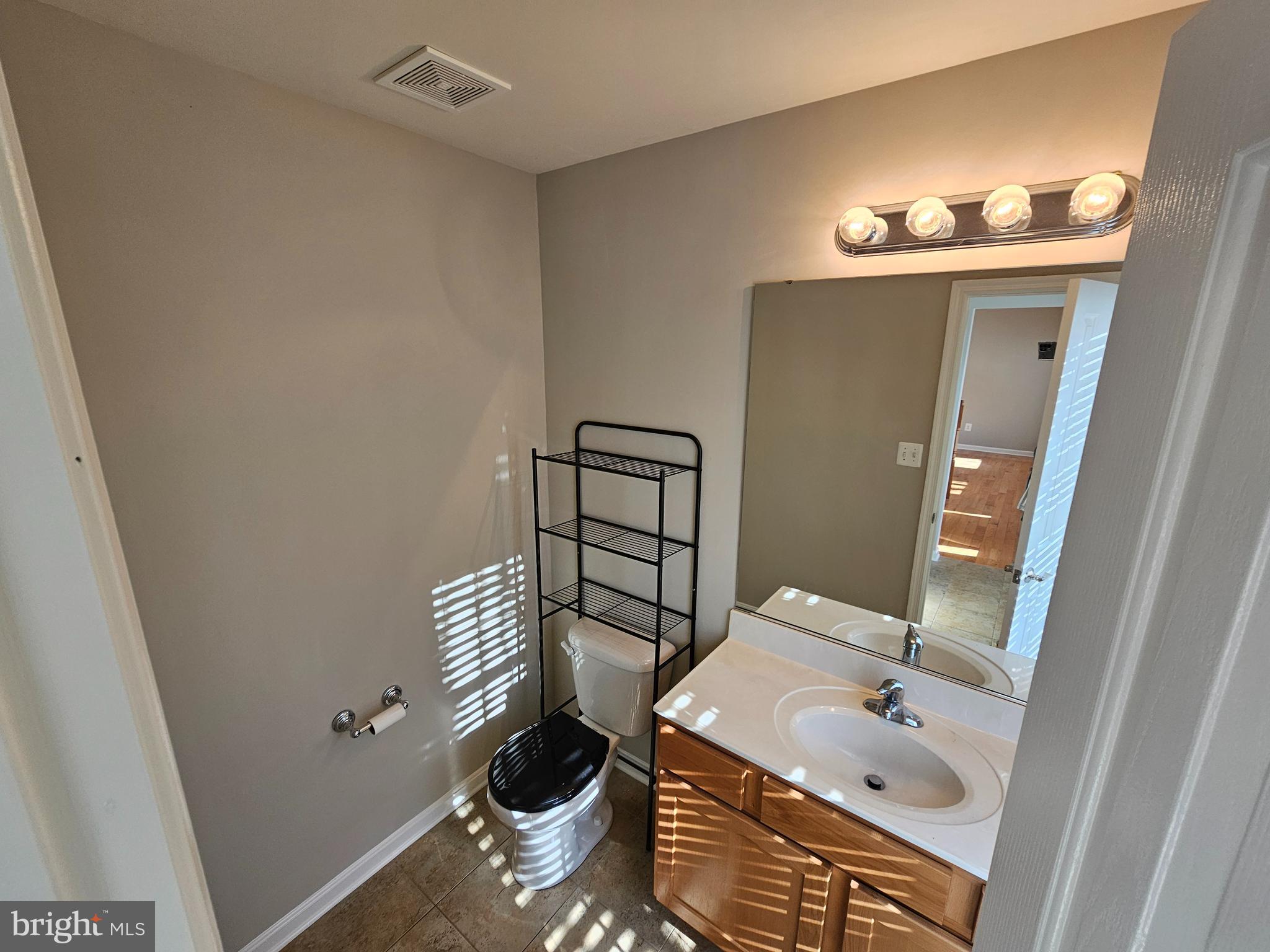 12560 Sagebrush Drive Lusby, MD 20657 - Photo 12 of 43 a bathroom with a sink toilet and shower