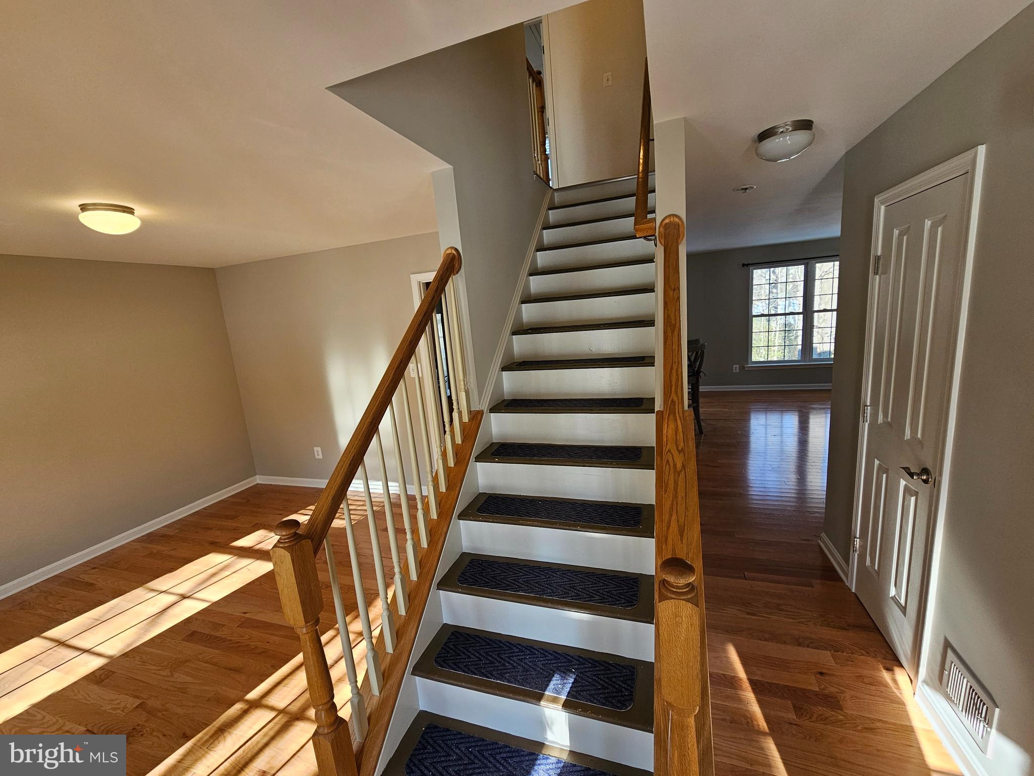 12560 Sagebrush Drive Lusby, MD 20657 - Photo 17 of 43 a view of entryway with wooden floor and stairs