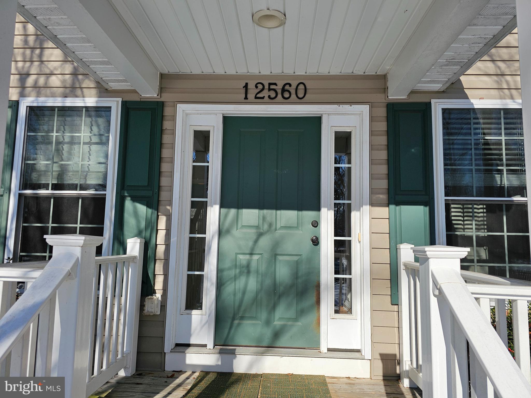 12560 Sagebrush Drive Lusby, MD 20657 - Photo 2 of 43 front view of a building with a glass door