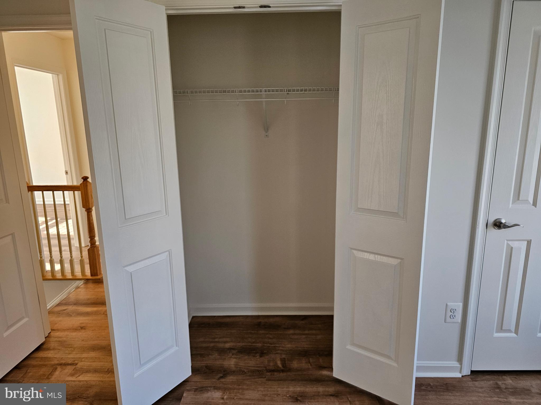 12560 Sagebrush Drive Lusby, MD 20657 - Photo 22 of 43 a view of an empty room with wooden floor and a window