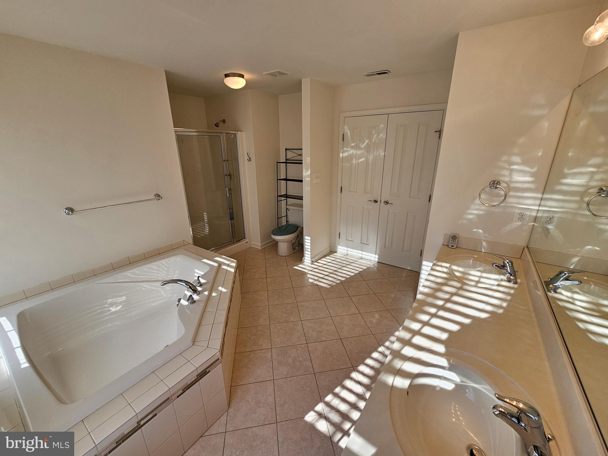 12560 Sagebrush Drive Lusby, MD 20657 - Photo 26 of 43 a bathroom with a tub a sink and glass door