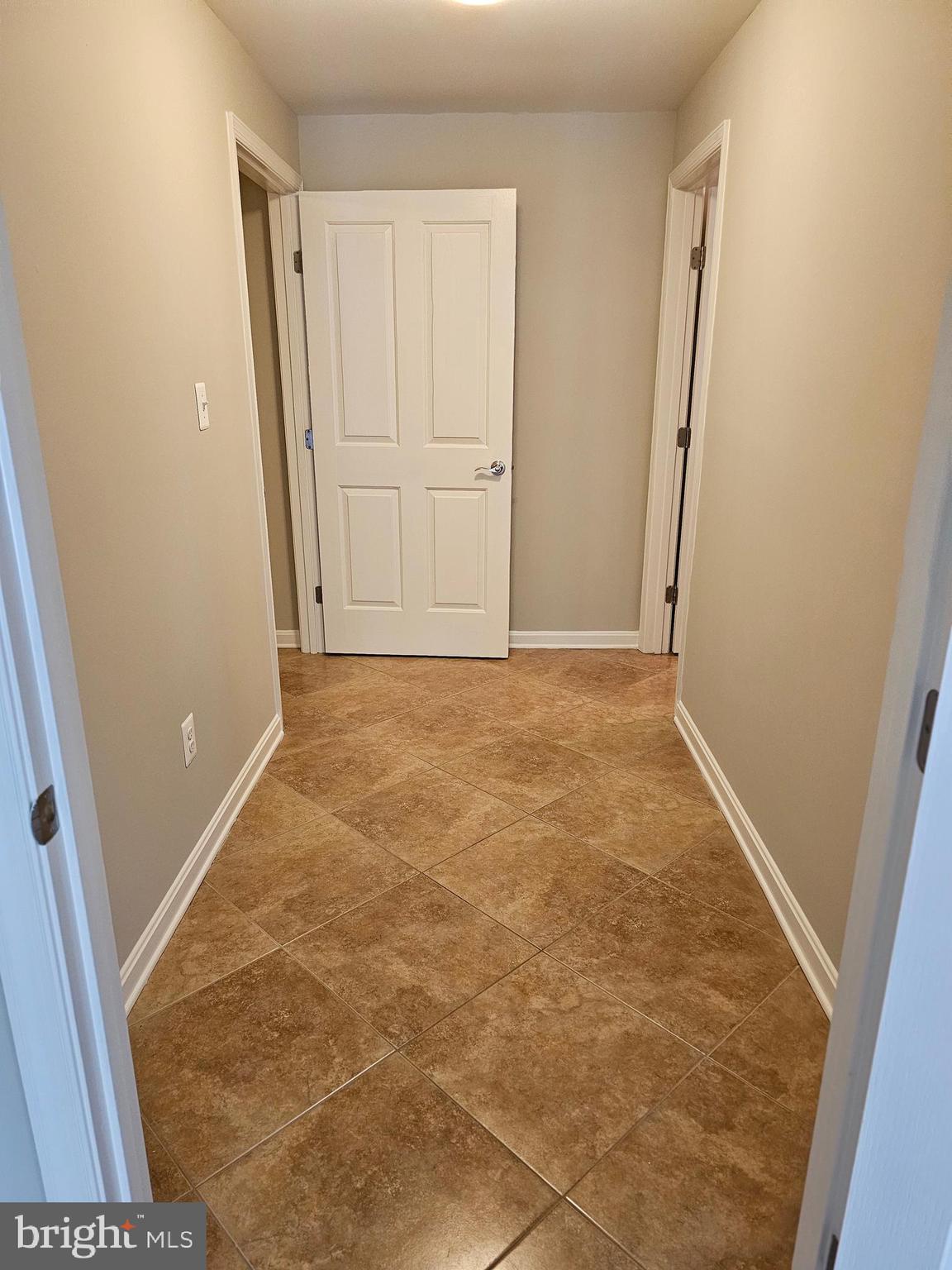 12560 Sagebrush Drive Lusby, MD 20657 - Photo 37 of 43 an empty room with an entrance door