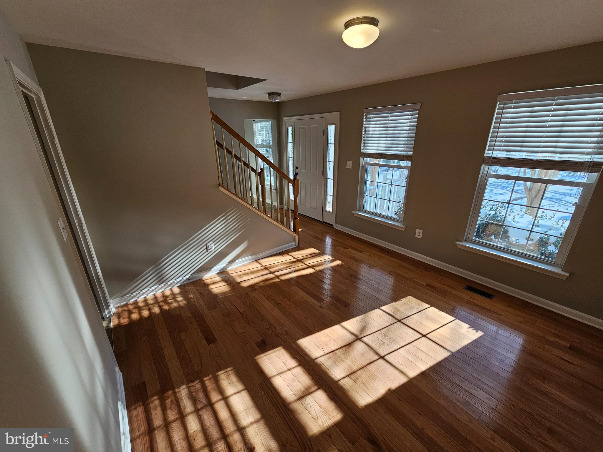12560 Sagebrush Drive Lusby, MD 20657 - Photo 10 of 43 a view of an empty room with windows