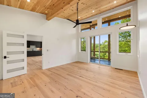 a spacious bedroom with a bed and a couch