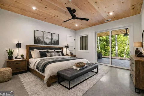 a bed room with a bed and a couch