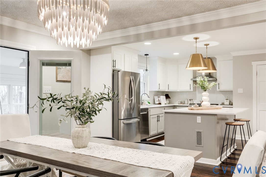 2831 Earlswood Road Midlothian, VA 23113 - Photo 14 of 47 a kitchen with stainless steel appliances granite countertop a sink and a refrigerator