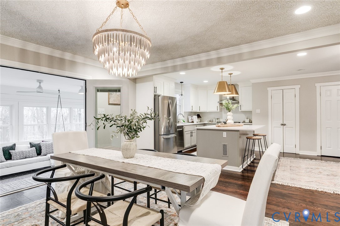 2831 Earlswood Road Midlothian, VA 23113 - Photo 16 of 47 a kitchen with stainless steel appliances kitchen island granite countertop a sink and cabinets