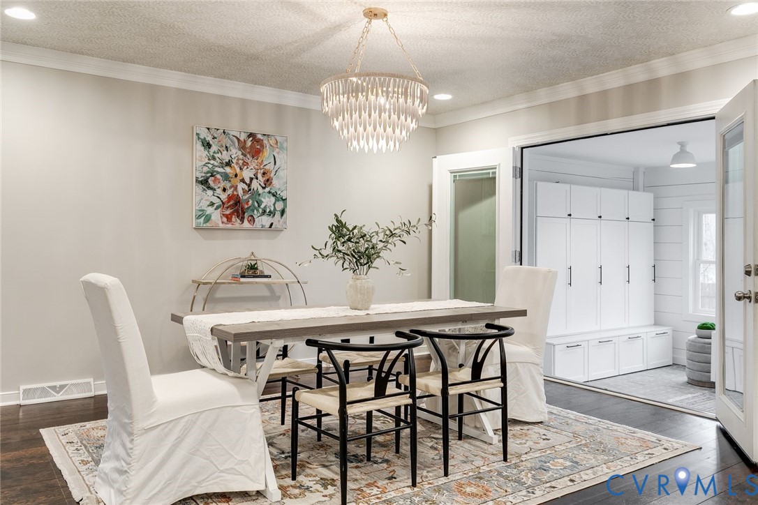 2831 Earlswood Road Midlothian, VA 23113 - Photo 17 of 47 a view of a dining room with furniture and chandelier