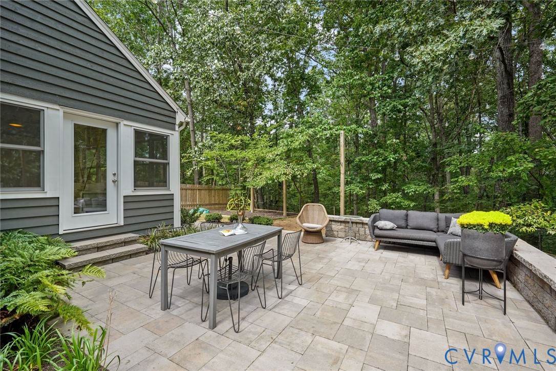 2831 Earlswood Road Midlothian, VA 23113 - Photo 36 of 47 a view of a patio with table and chairs and potted plants