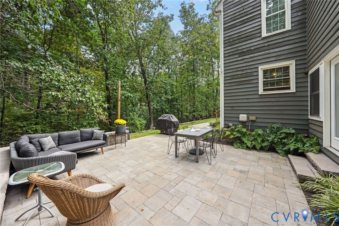 2831 Earlswood Road Midlothian, VA 23113 - Photo 38 of 47 a view of a patio with couches and a table and chairs with garden view