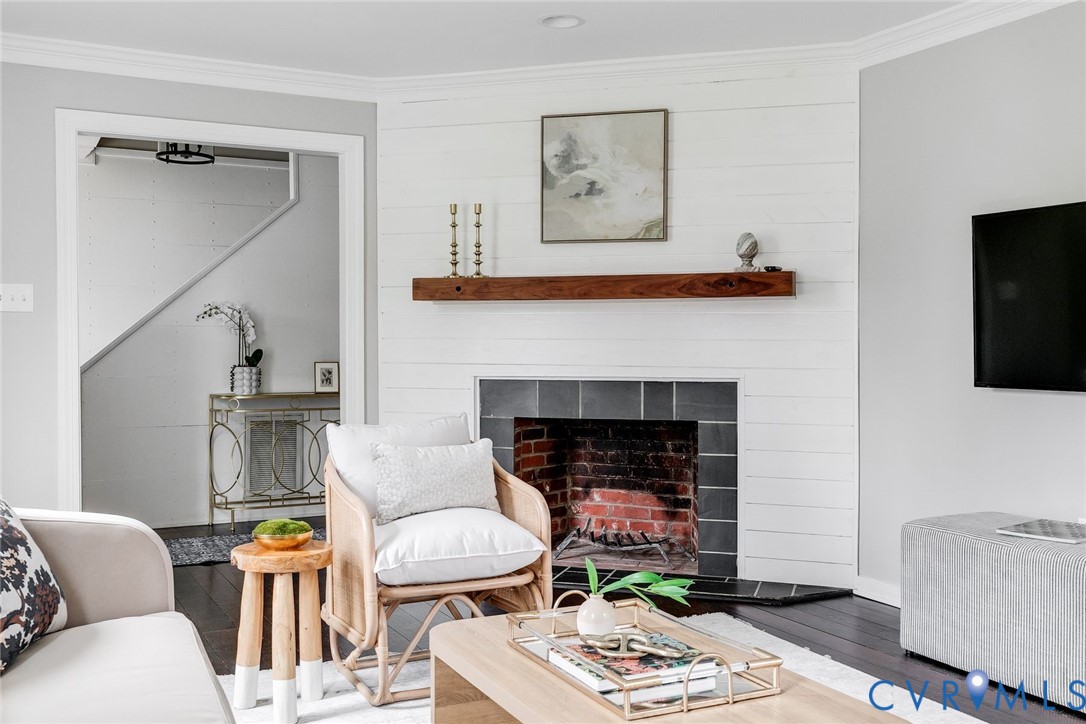 2831 Earlswood Road Midlothian, VA 23113 - Photo 4 of 47 a living room with furniture a flat screen tv and a fireplace