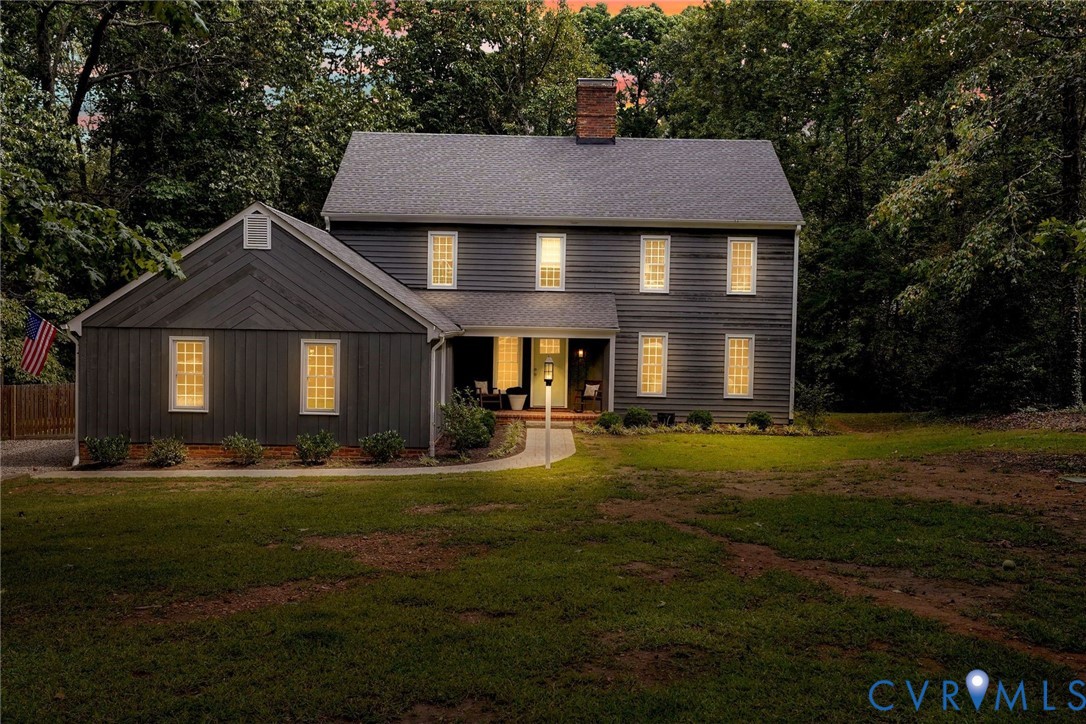 2831 Earlswood Road Midlothian, VA 23113 - Photo 46 of 47 a front view of a house with a yard and trees