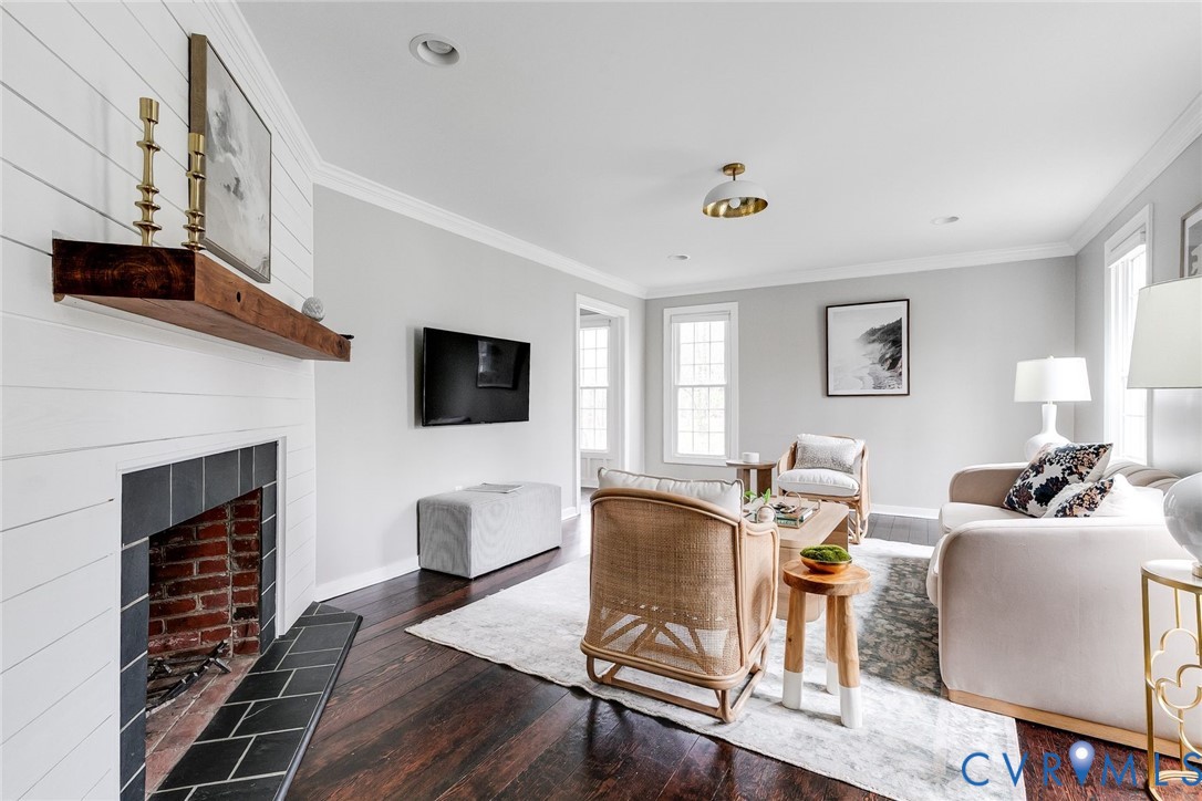 2831 Earlswood Road Midlothian, VA 23113 - Photo 6 of 47 a living room with furniture a flat screen tv and a fireplace