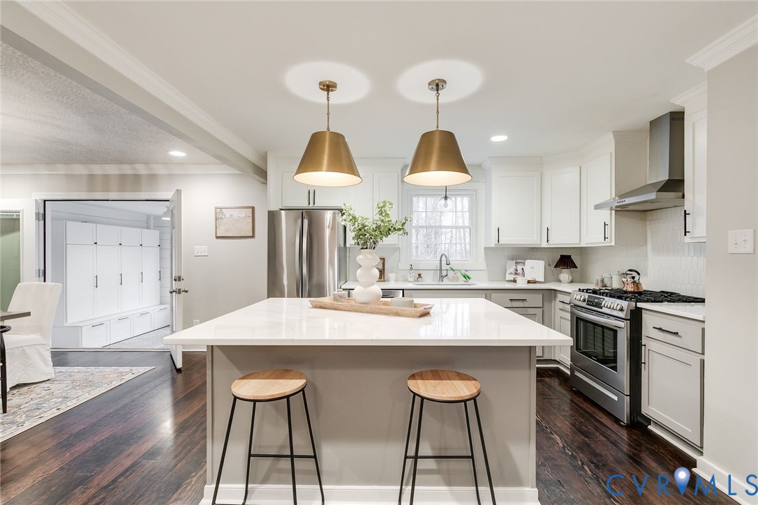 2831 Earlswood Road Midlothian, VA 23113 - Photo 10 of 47 a kitchen with stainless steel appliances a sink a stove a refrigerator cabinets and dining table
