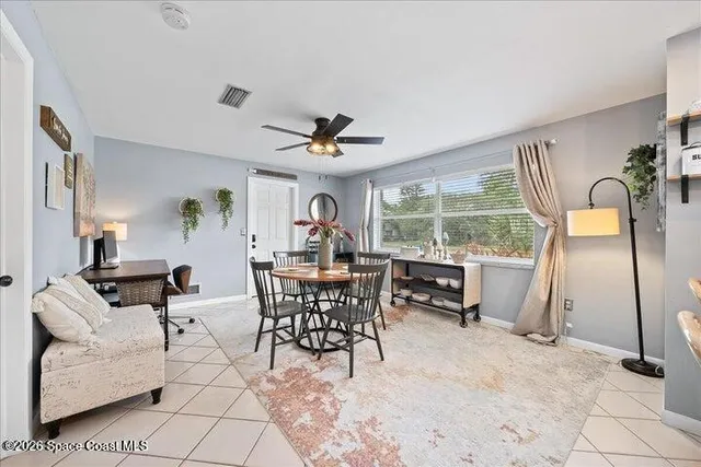 a living room with furniture a window and a table