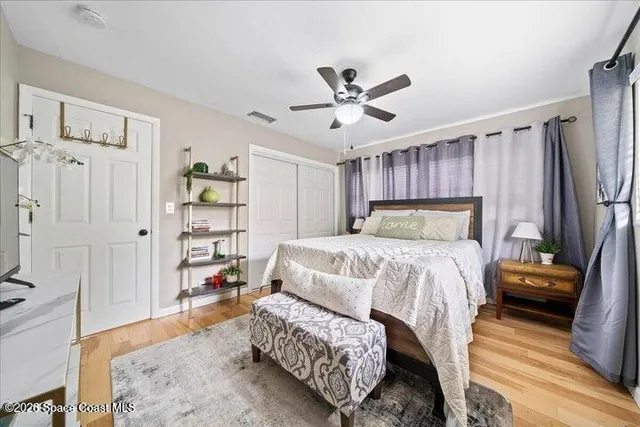 a bedroom with a bed furniture and a window