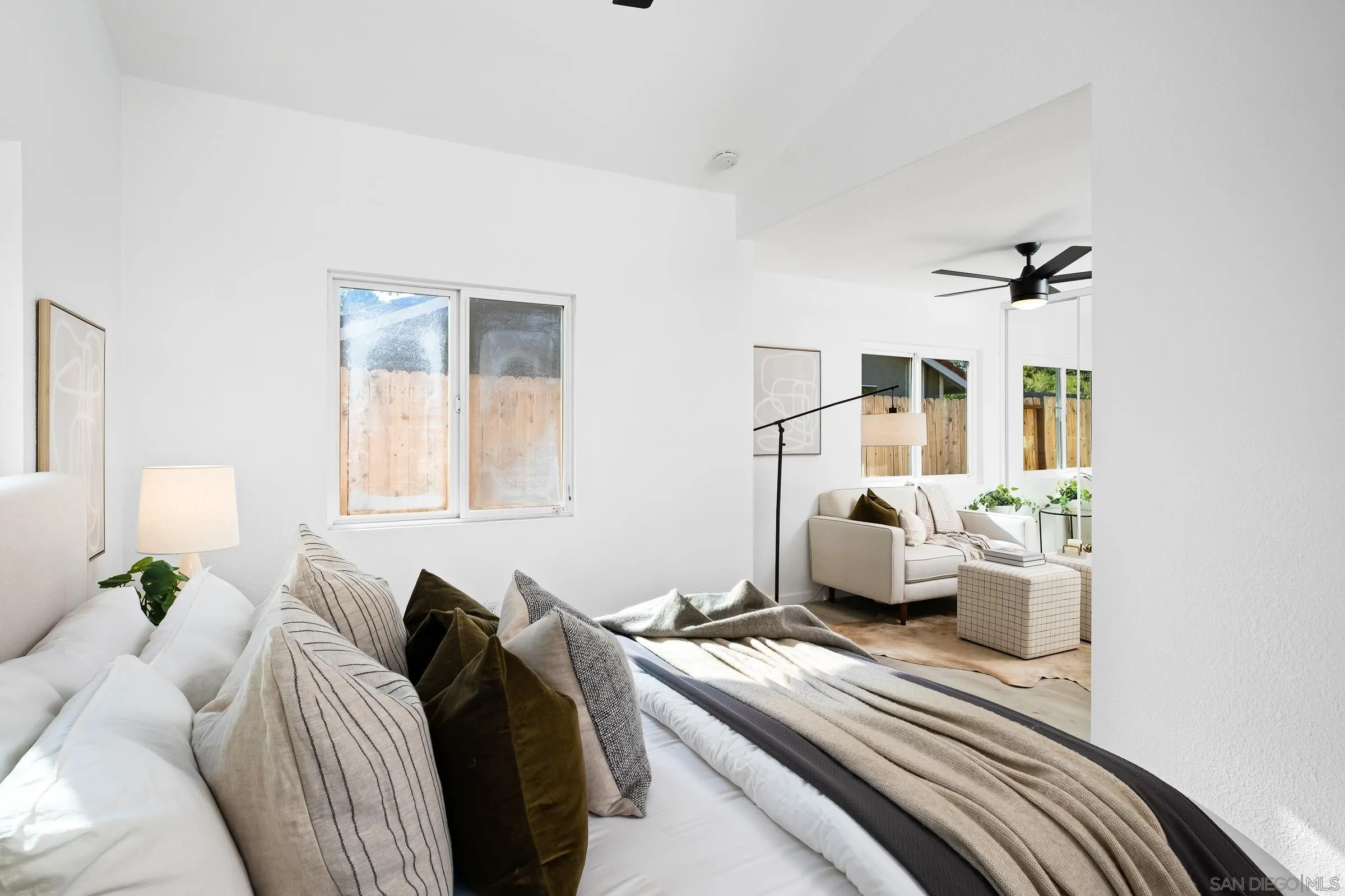 2457 Jasper Glen Escondido, CA 92029 - Photo 13 of 22 a bedroom with a bed couch and a window