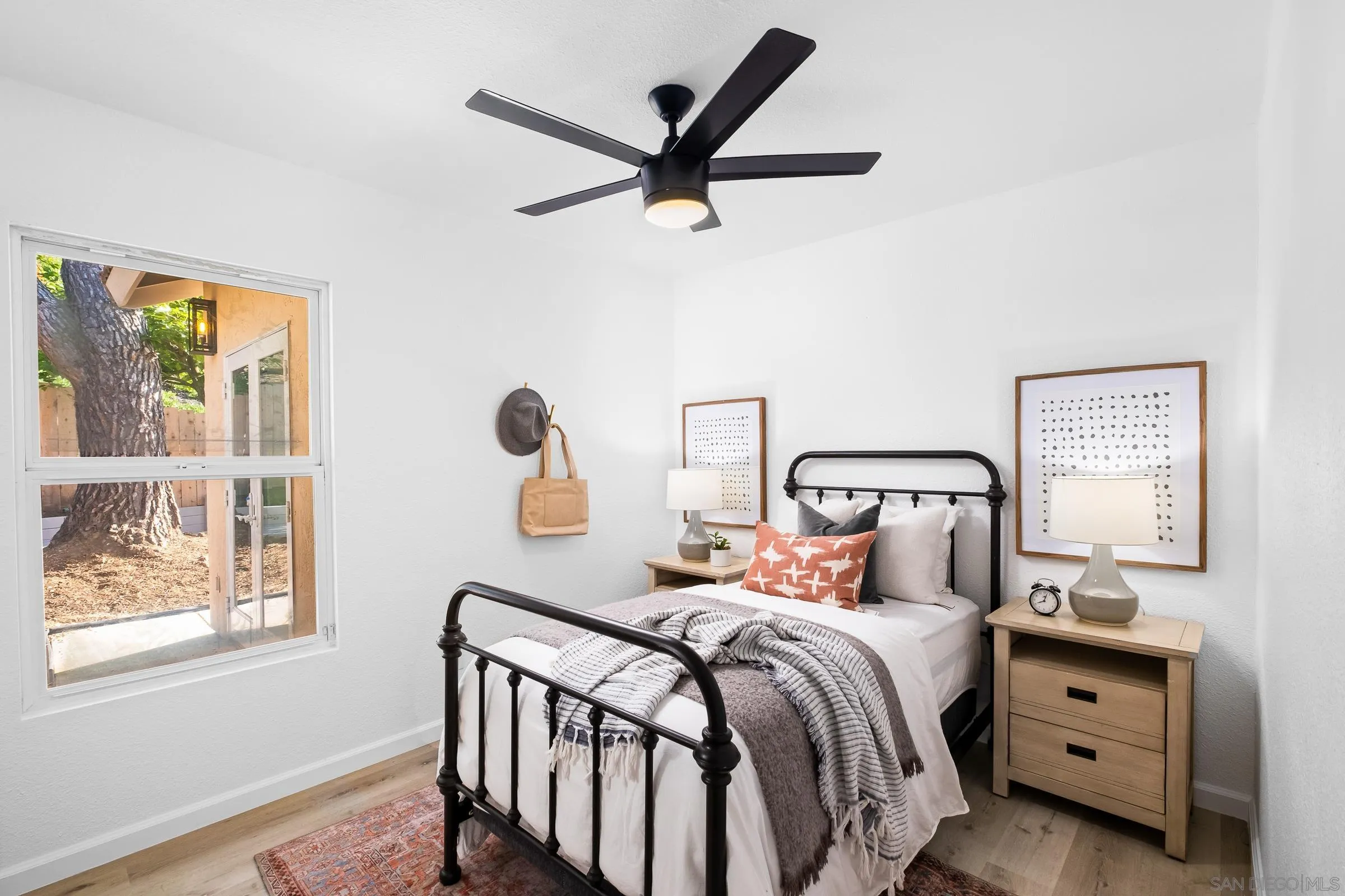 2457 Jasper Glen Escondido, CA 92029 - Photo 15 of 22 a bedroom with a bed and a window