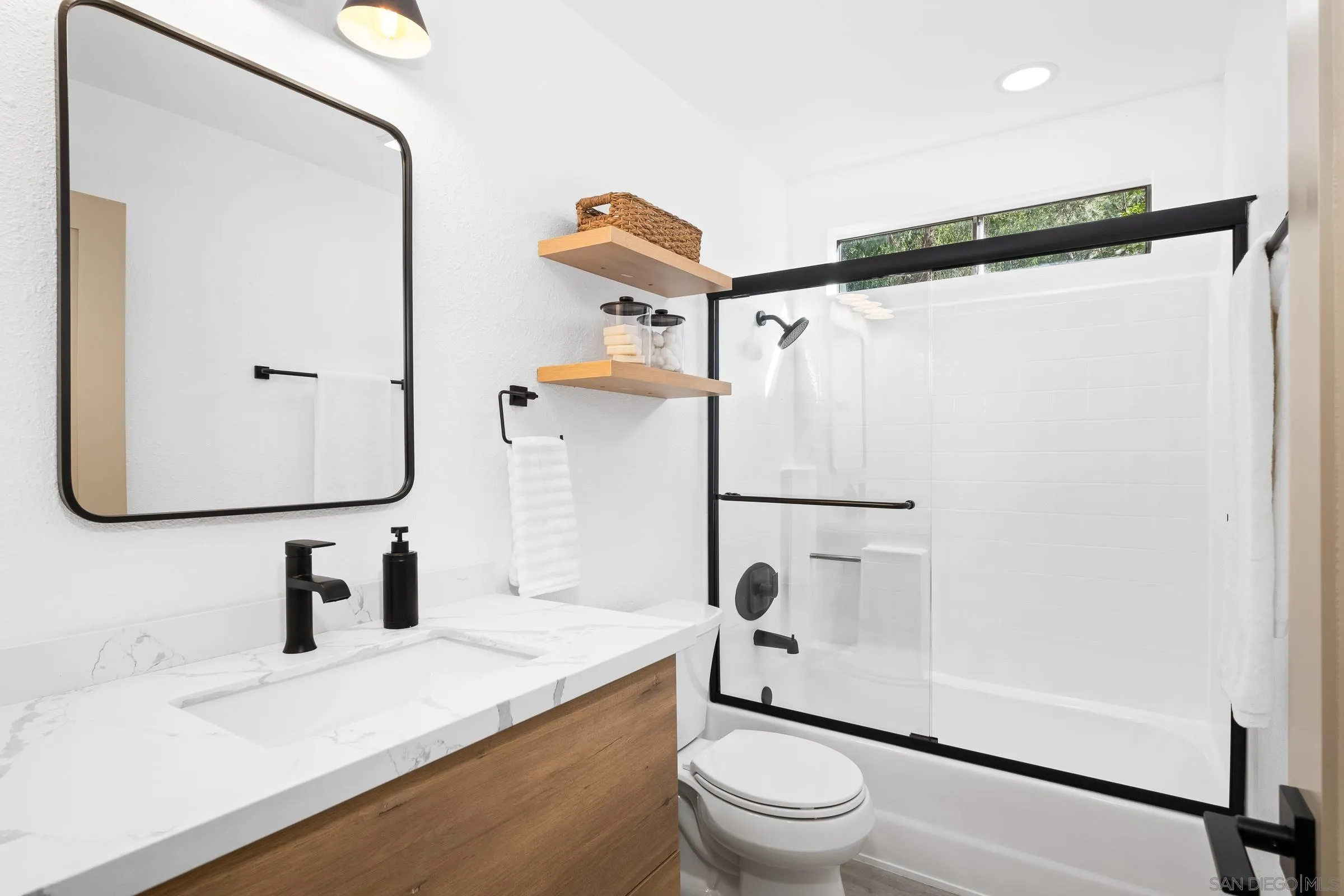 2457 Jasper Glen Escondido, CA 92029 - Photo 16 of 22 a bathroom with a granite countertop sink toilet and shower