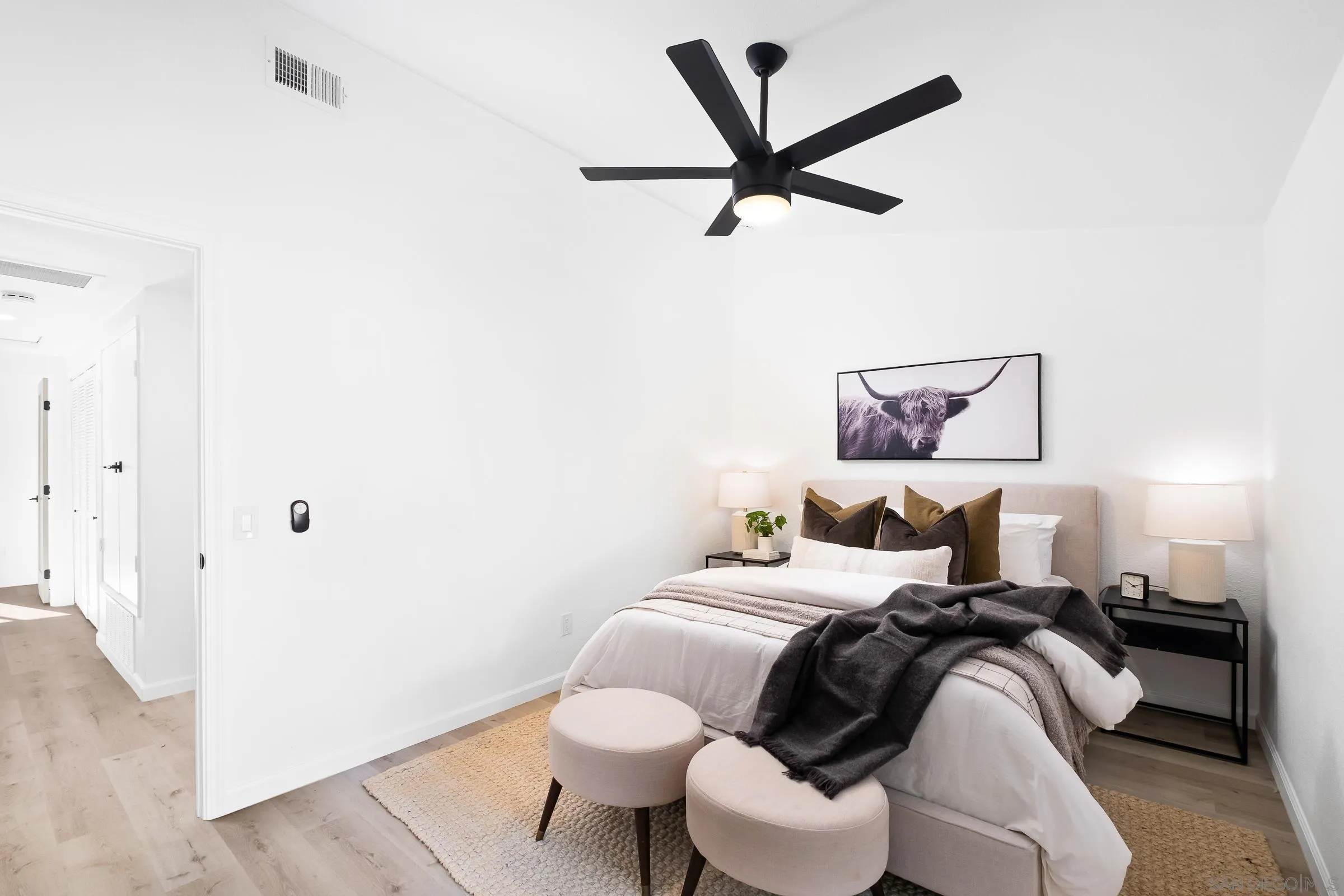 2457 Jasper Glen Escondido, CA 92029 - Photo 19 of 22 a bedroom with a bed and painting on the wall