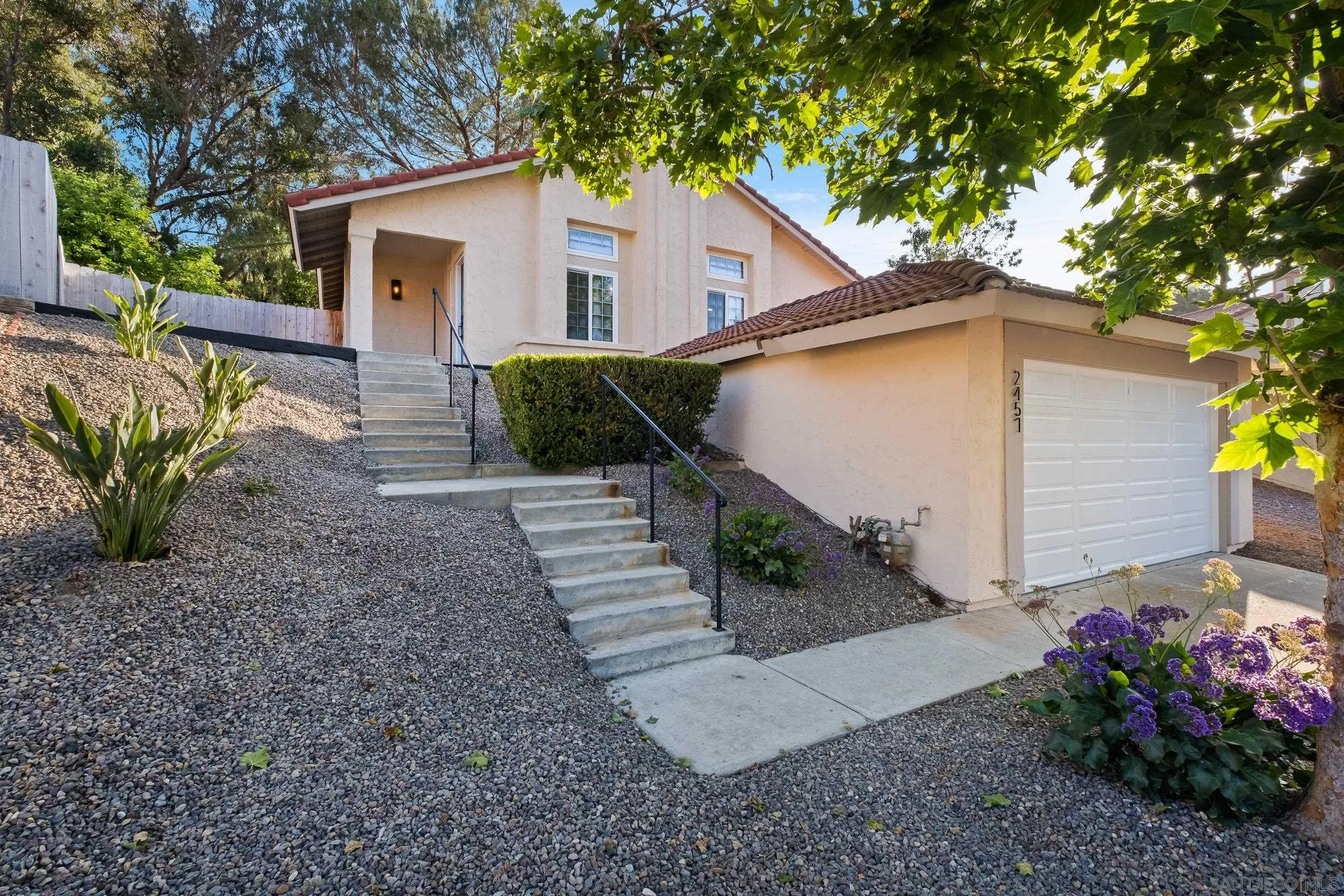 2457 Jasper Glen Escondido, CA 92029 - Photo 2 of 22 a view of a house with a yard and potted plants