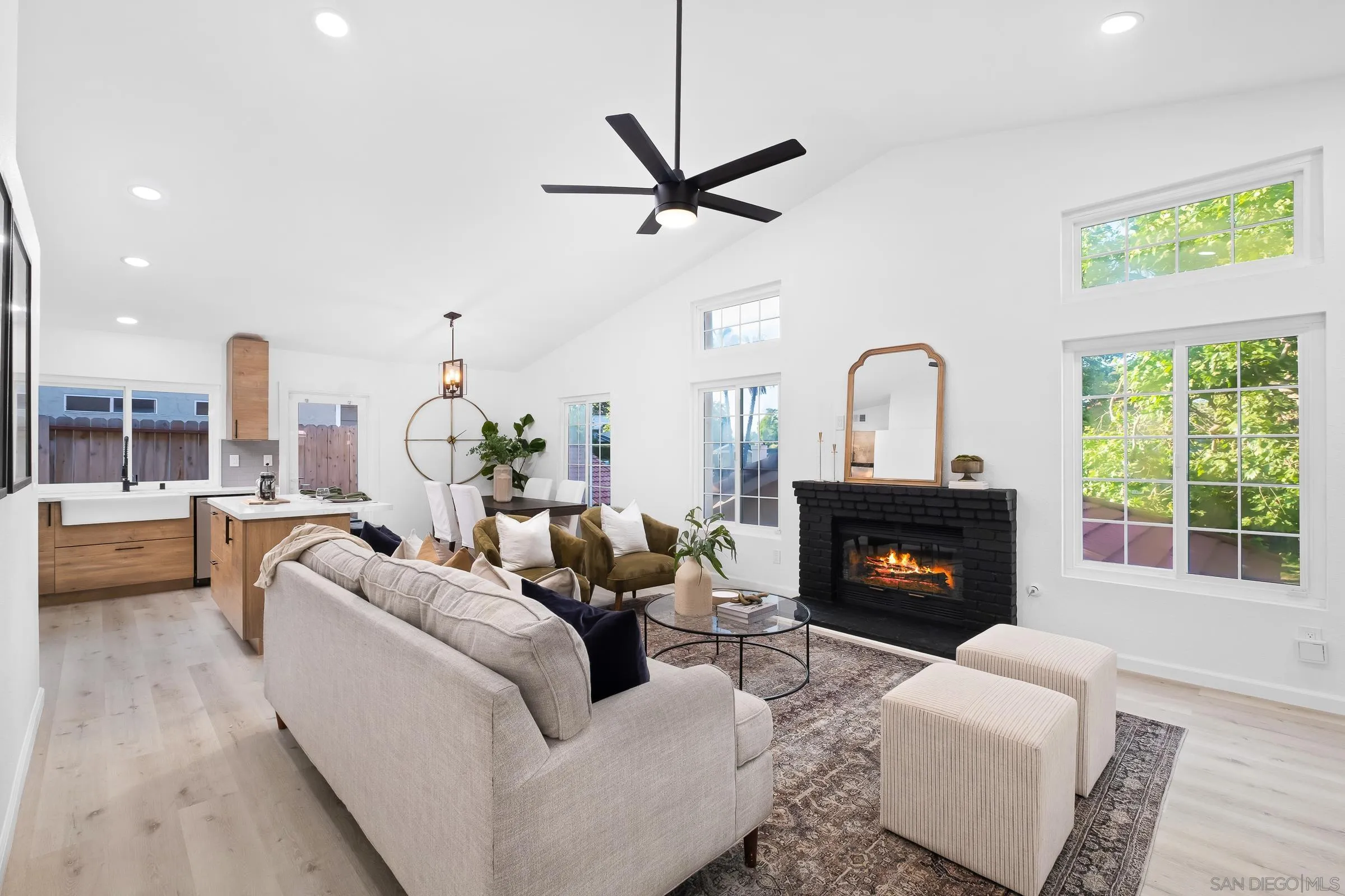 2457 Jasper Glen Escondido, CA 92029 - Photo 6 of 22 a living room with furniture fireplace and a large window