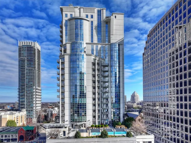 a view of a swimming pool with chairs