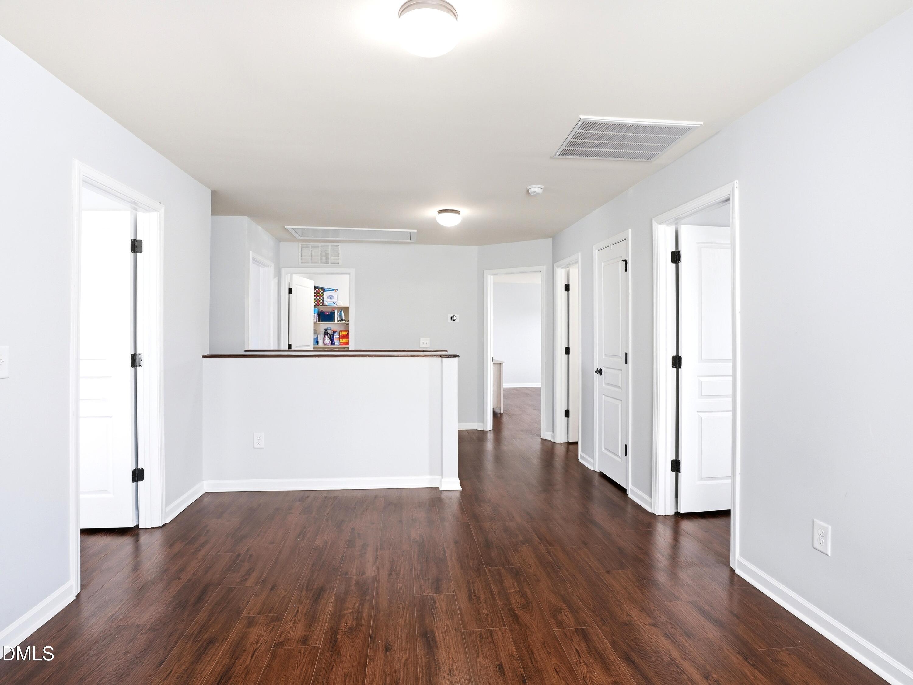 8128 Hovingham Way Raleigh, NC 27616 - Photo 20 of 40 a view of a kitchen with wooden floor and a sink