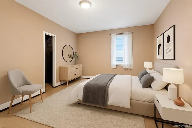 a bedroom with bed and window