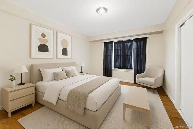 a spacious bedroom with a bed and glass door