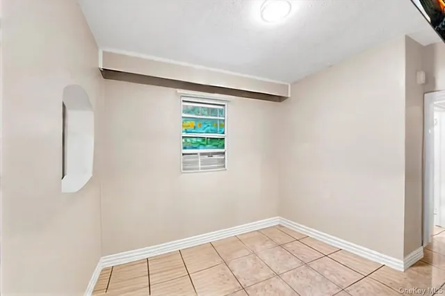 a view of an empty room with windows