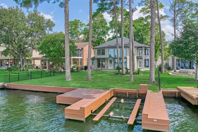 a view of a house with a yard and a patio